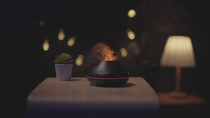 Soothing mist. Peaceful music plays. The oil sent wafts through the air. Panning across the table and by the books. To work in peace. To relax in a whole new way. What a way to transform the space with the 'Essential Oil Diffuser'.